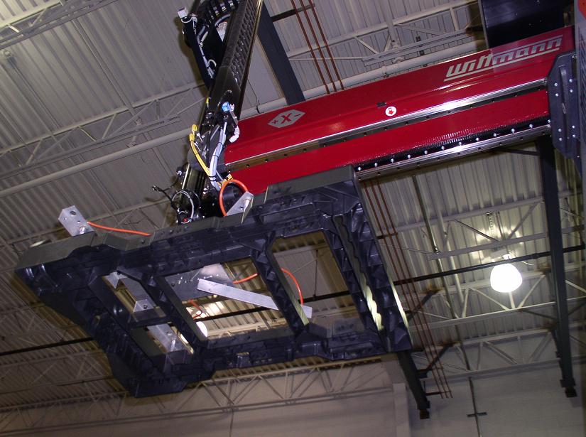 Robotic crane removing HTS main frame